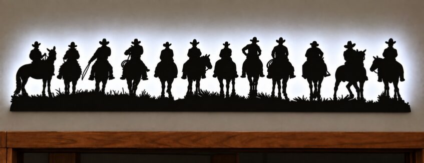 Backlit Cowboy Metal Wall Art – 12 Cowboys on Horses 46" x 9"