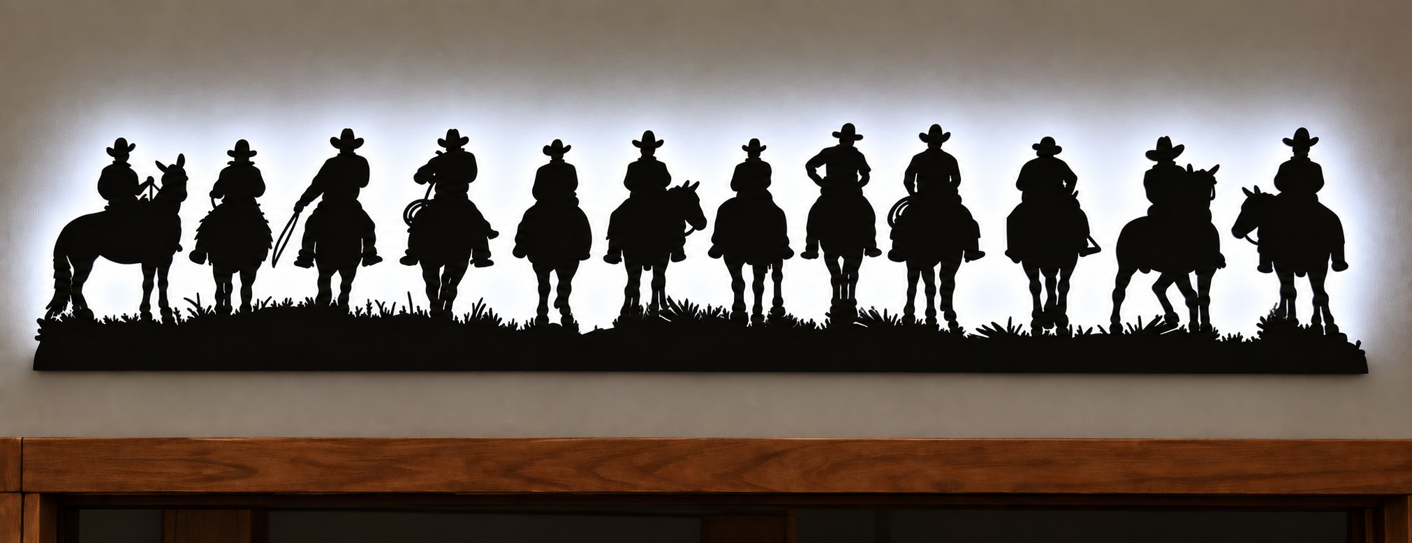 Backlit Cowboy Metal Wall Art – 12 Cowboys on Horses 46" x 9"